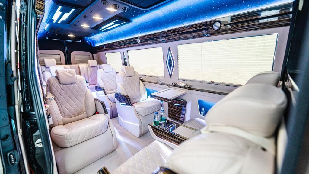 Interior of a Mercedes Sprinter with facing leather seats