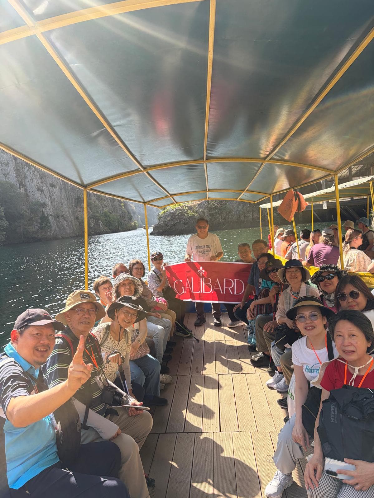 Galibarda group on a boat with the Galibarda flag
